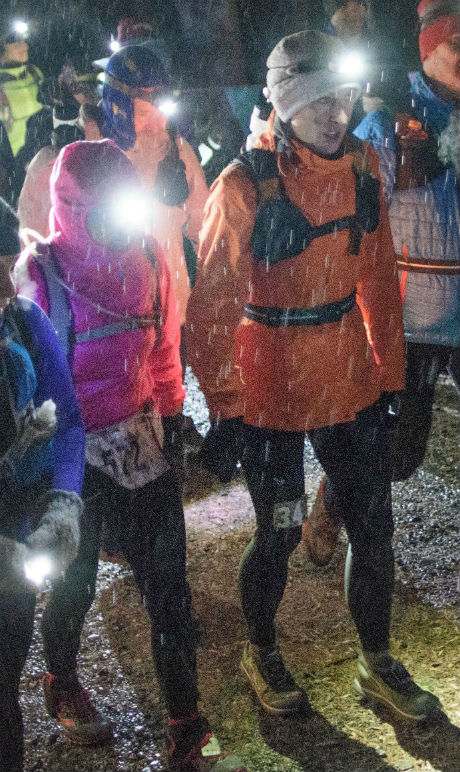 In freezing rain, the start of the Devil Dog 100 - Stephanie Fonda in orange jacket, ^z following in white windbreaker - photo by David Potts