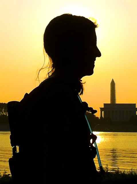 Kate Abbott on the Potomac River at sunrise in front of the Washington Monument and Lincoln Memorial